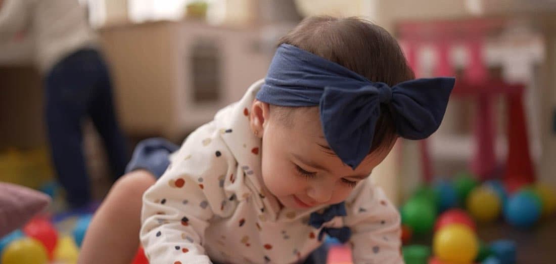 A baby exploring the play area